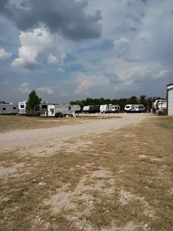 RVs and trailers on open 20x40 spaces at Quiet Stay RV Park in Morrison, OK